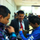 Learning how to tie a tie at the Color of Leadership Boys' Conference