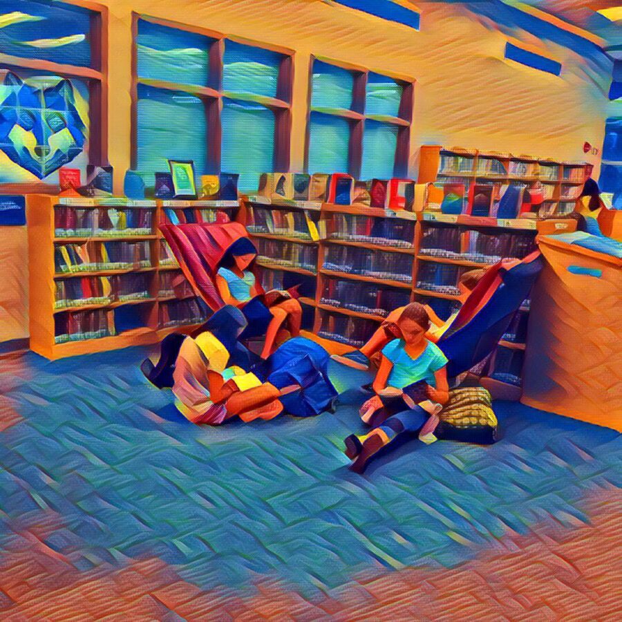 students reading in the comfy chairs