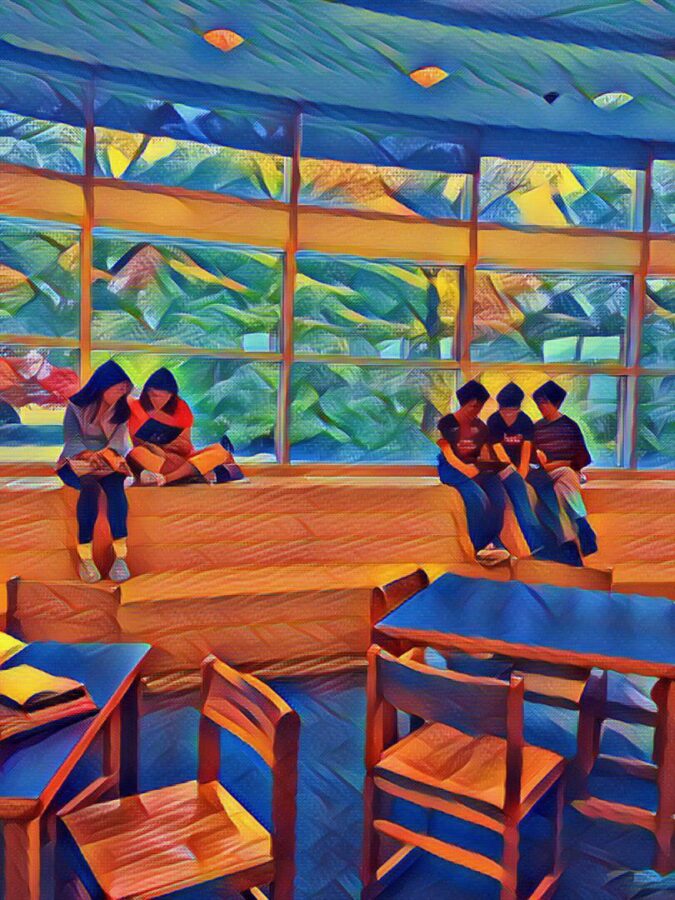 students reading in the library windows