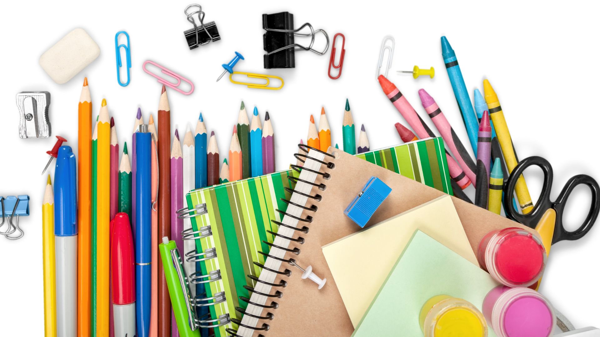 image of school supplies: pencils, notebooks, crayons, paper clips