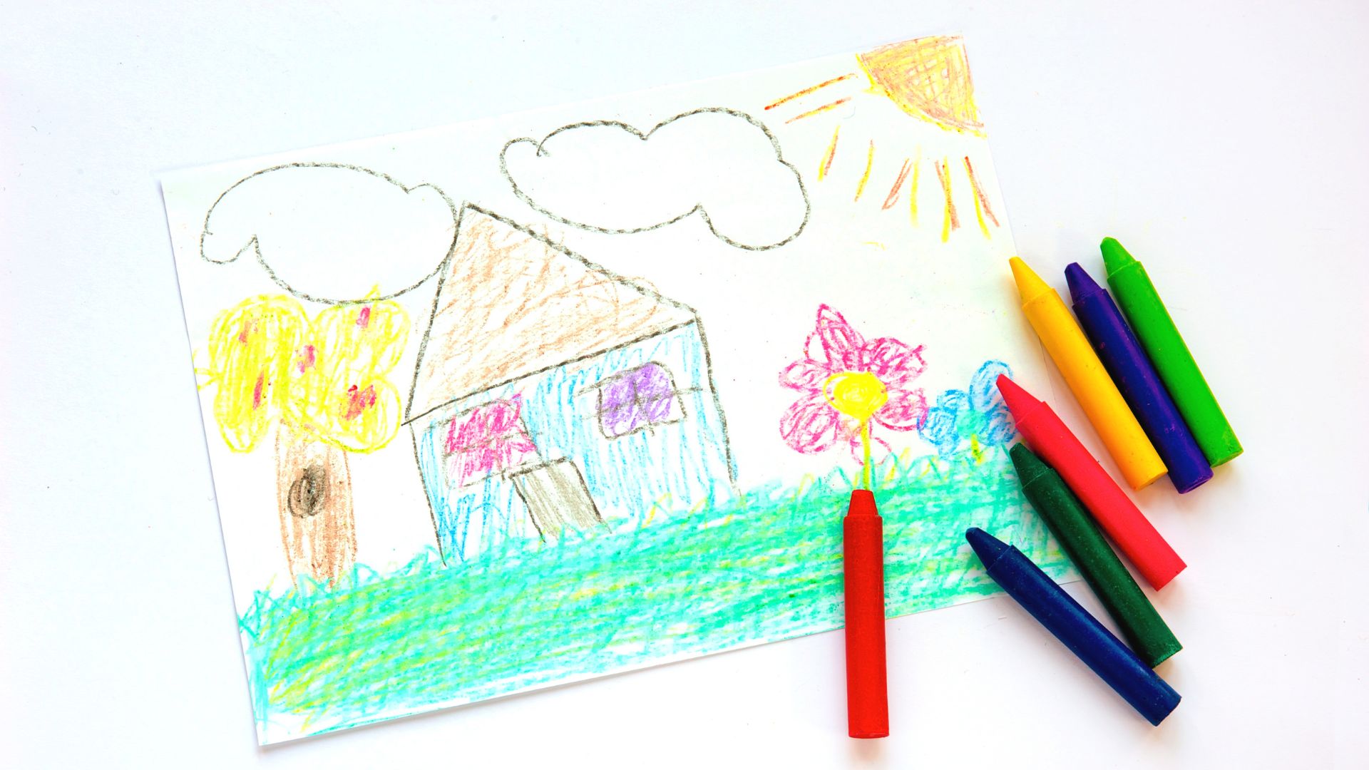 crayon drawing of a house and flowers